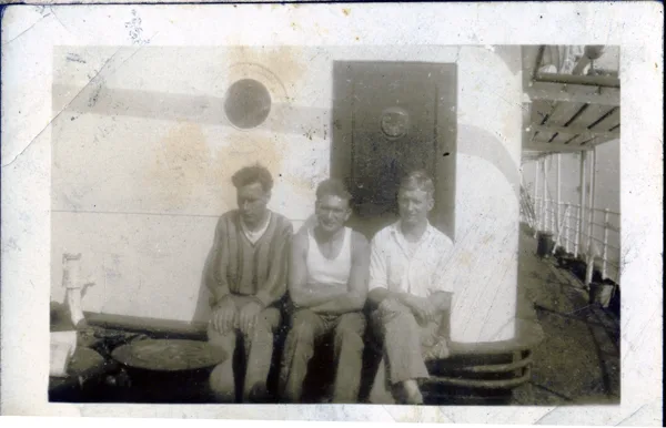 Three sailors on ship, view 3. Hans is on the left. Identification supplied by the family. Vessel, location and date remain unconfirmed.