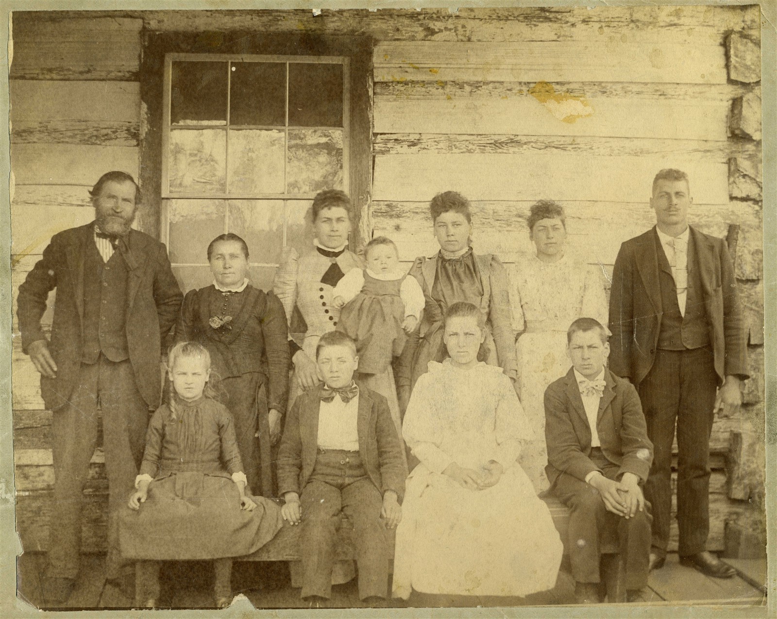 The Hilpert family outside their log house in 1892